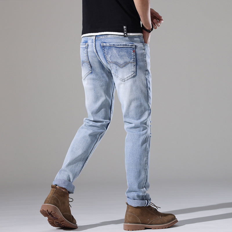 Moda Elite | Jeansy z podartymi nogawkami i dopasowanym krojem