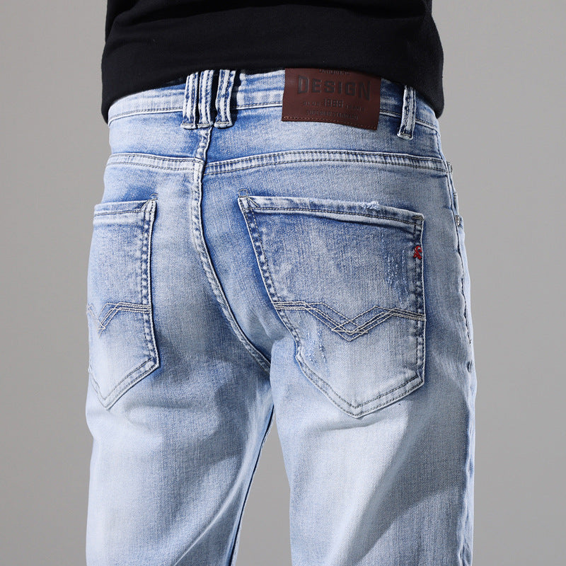 Moda Elite | Jeansy z podartymi nogawkami i dopasowanym krojem
